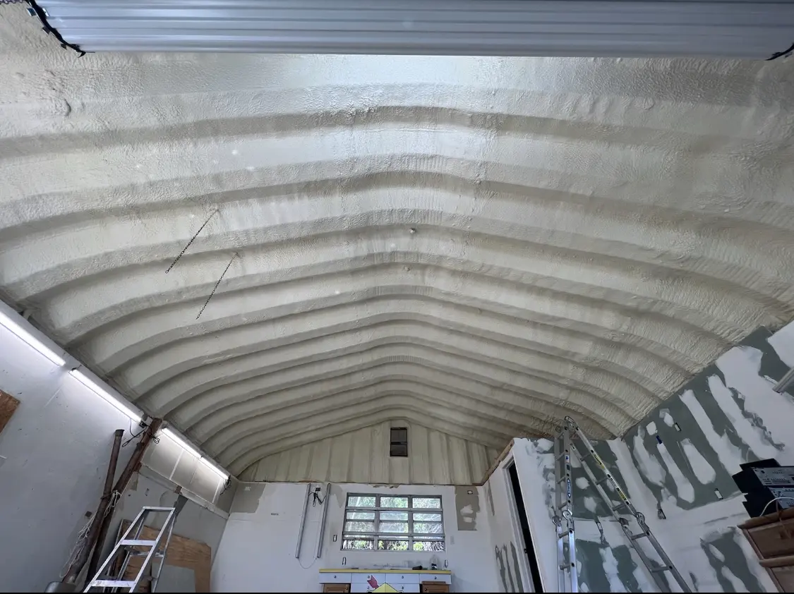 Spray polyurethane foam applied to the underside of a metal roof deck in Watchung